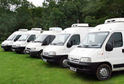 Five catering vans lined up in a row